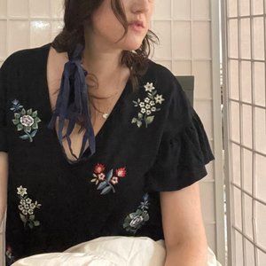 Embroidered black flutter sleeve top